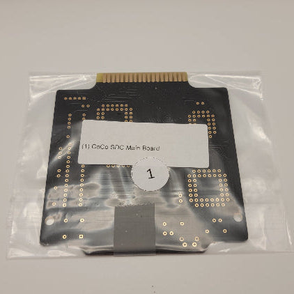 Computer motherboard in a clear plastic bag with a label on a white background