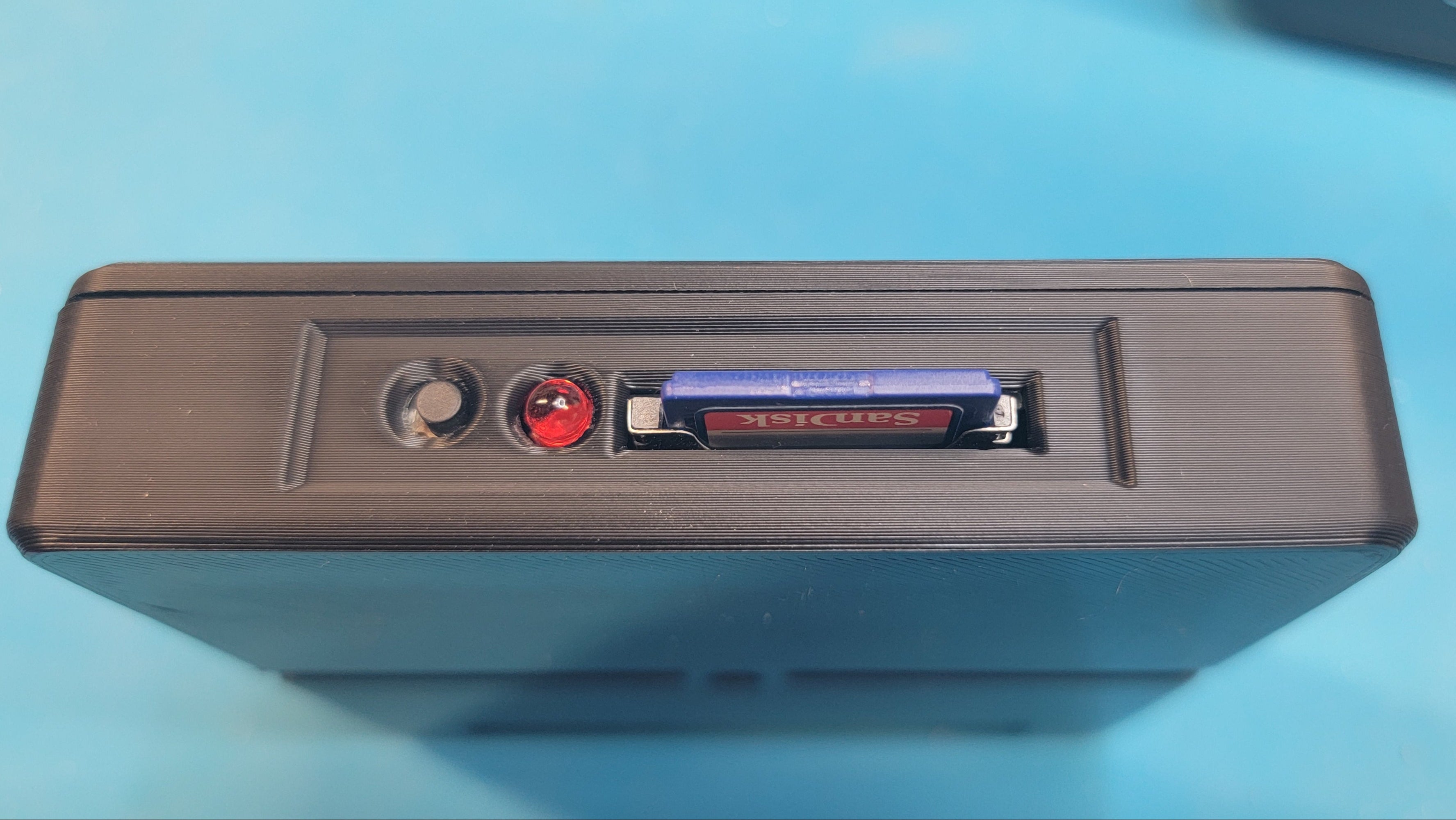 BoysonTech version of the CoCo SDC  side view with SDC card installed. SDC card is NOT included with unit.