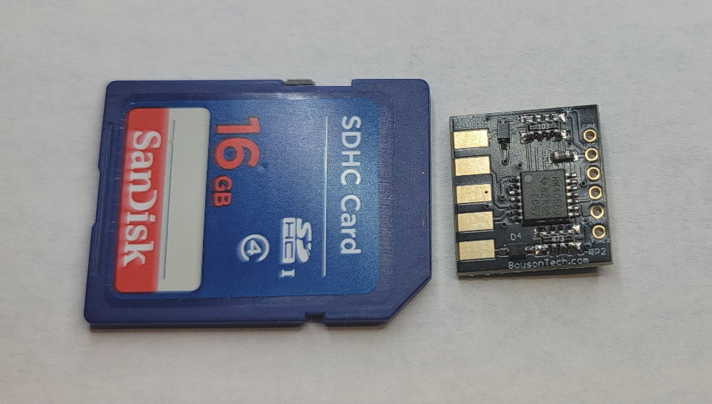Paragon Joystick Adapter bare board comparison with SDC card. The 14mm x 14mm board fits inside a standard DB9 hood.